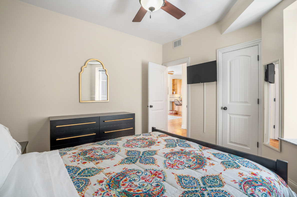 2117 West Irving Park Road, Unit 2R Chicago, IL 60618 - Photo 10 of 16 a bedroom with a bed and a dresser