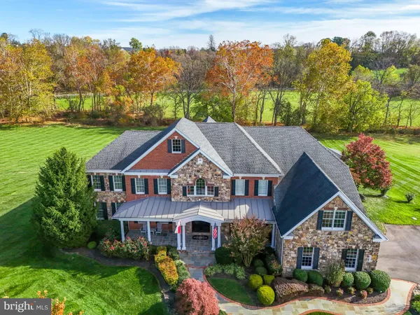 an aerial view of a house with a garden