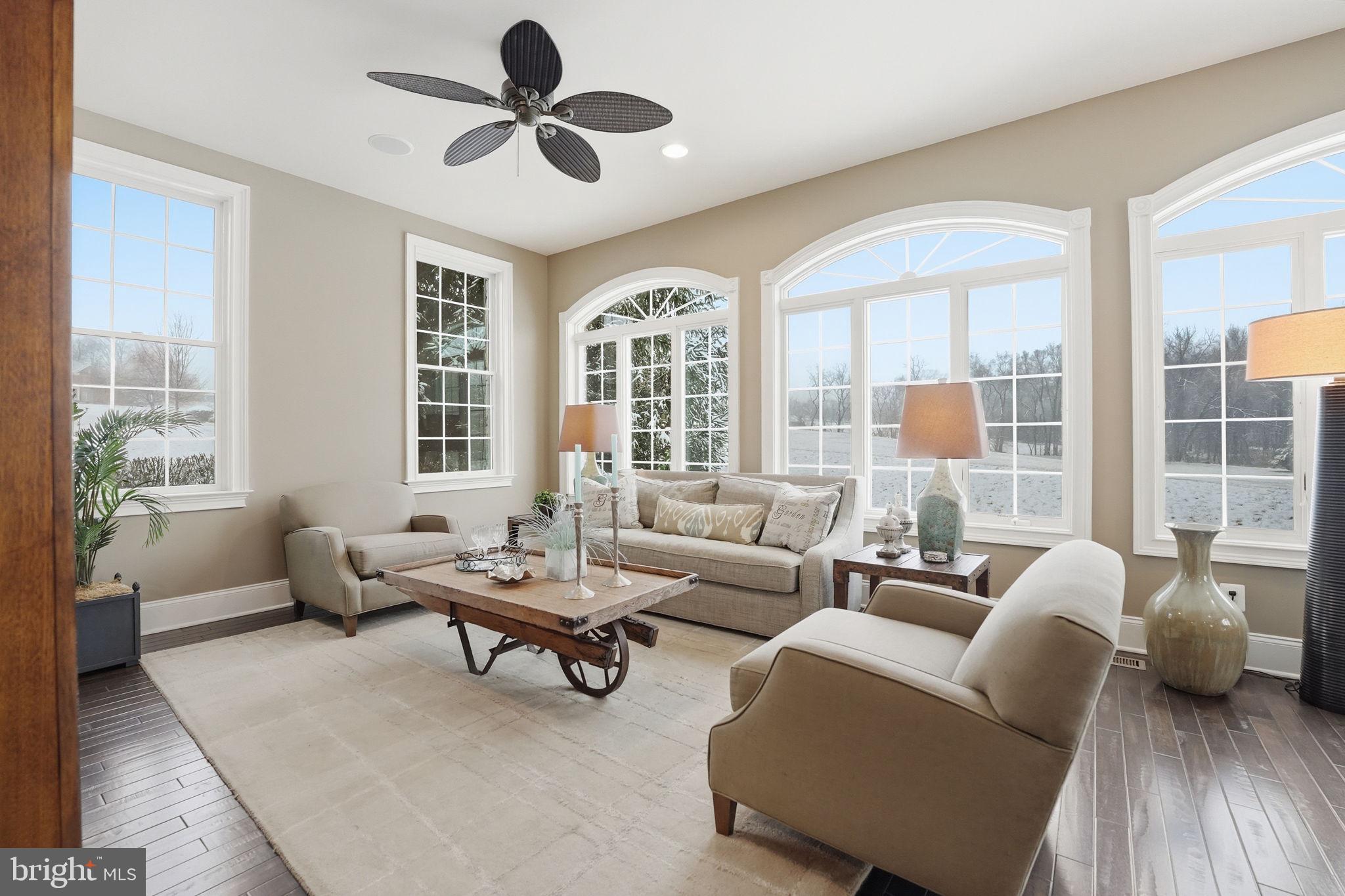 17972 Running Colt Place Leesburg, VA 20175 - Photo 13 of 99 a living room with furniture and a large window