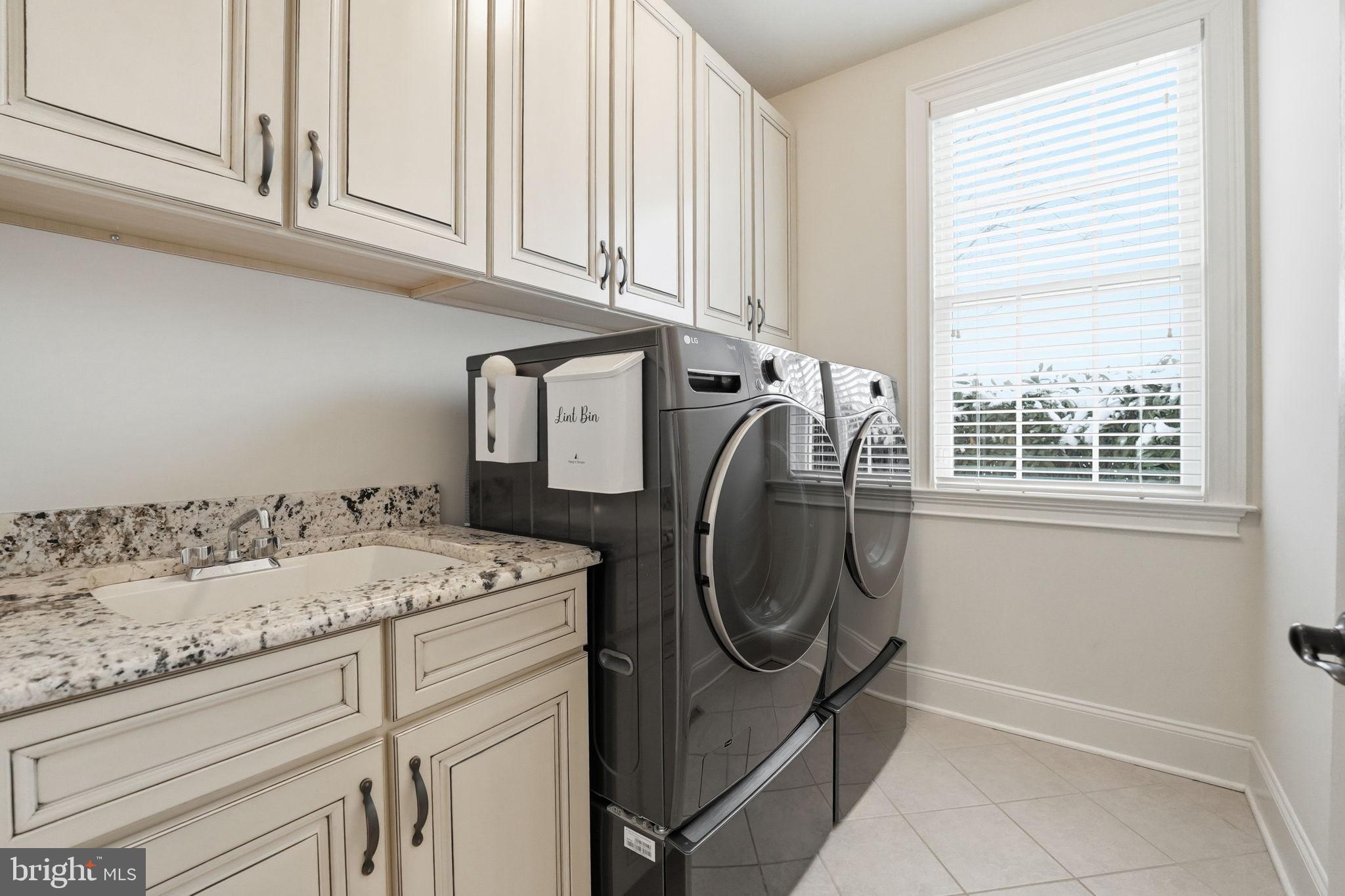 17972 Running Colt Place Leesburg, VA 20175 - Photo 38 of 99 a utility room with dryer and washer