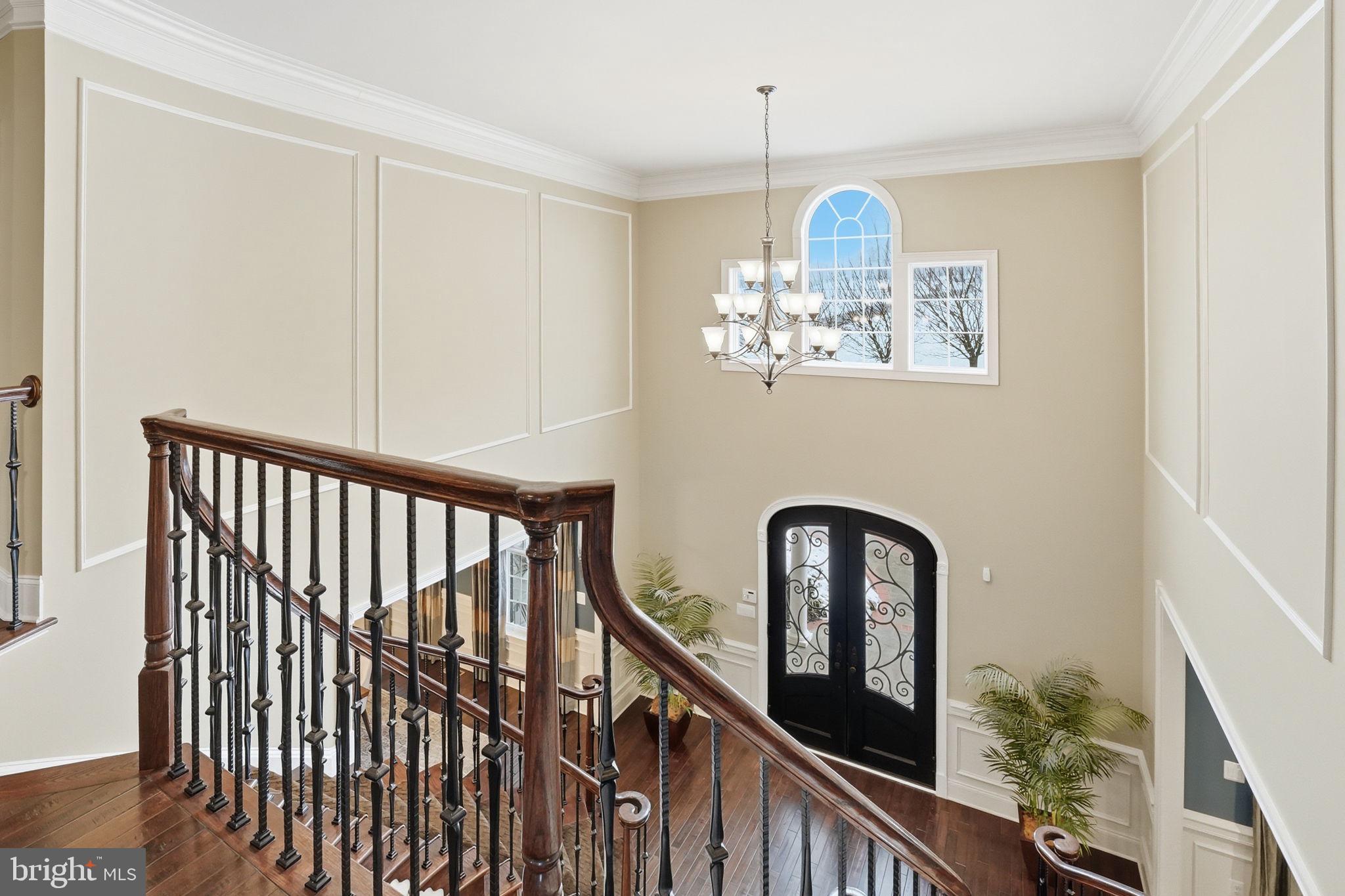 17972 Running Colt Place Leesburg, VA 20175 - Photo 42 of 99 a view of staircase with wooden floor and a potted plant