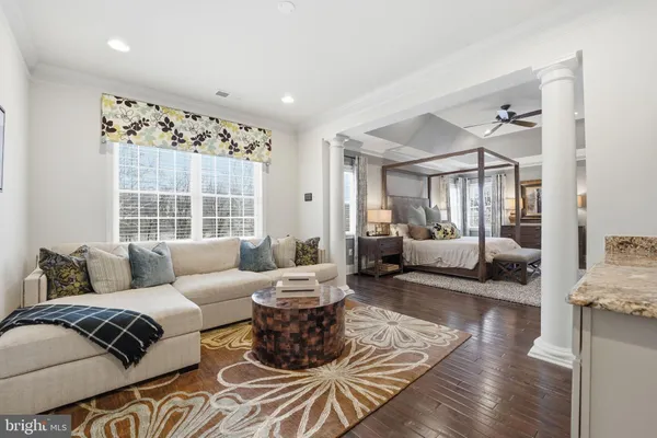 a bathroom with a bathtub shower sink vanity and toilet