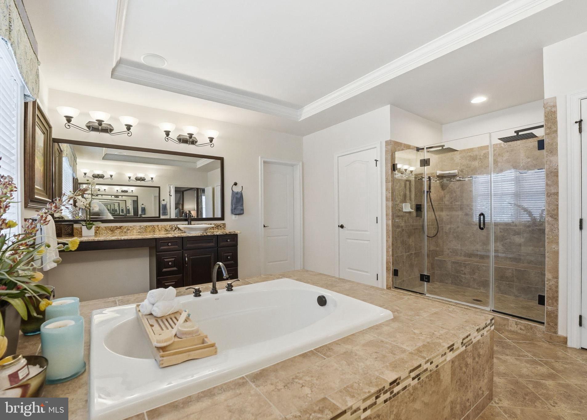 17972 Running Colt Place Leesburg, VA 20175 - Photo 53 of 99 a spacious bathroom with a double vanity sink and a mirror