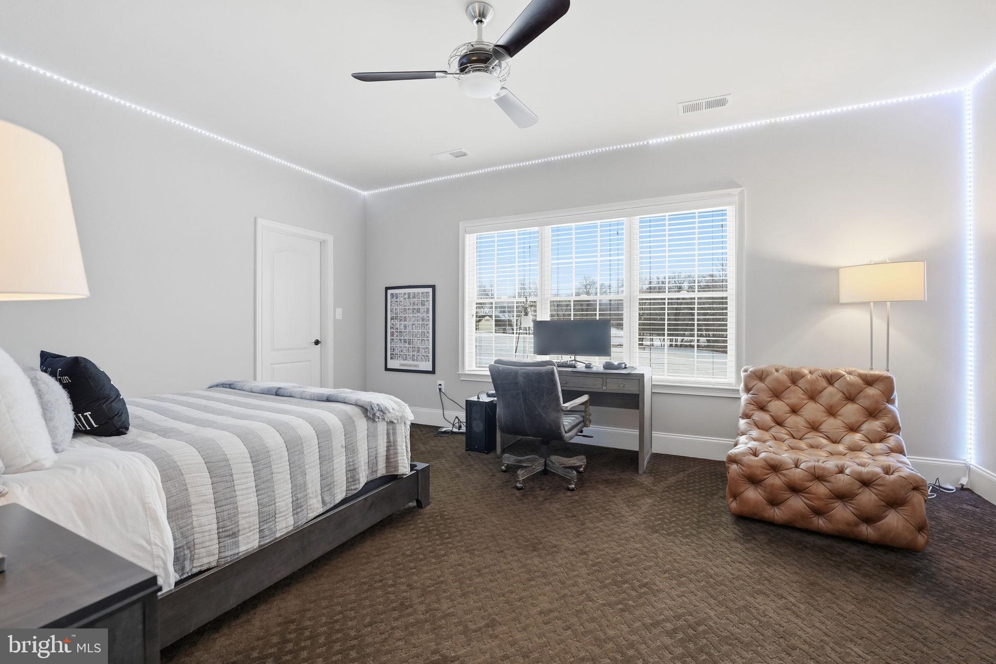 17972 Running Colt Place Leesburg, VA 20175 - Photo 62 of 99 a bedroom with a bed and a desk