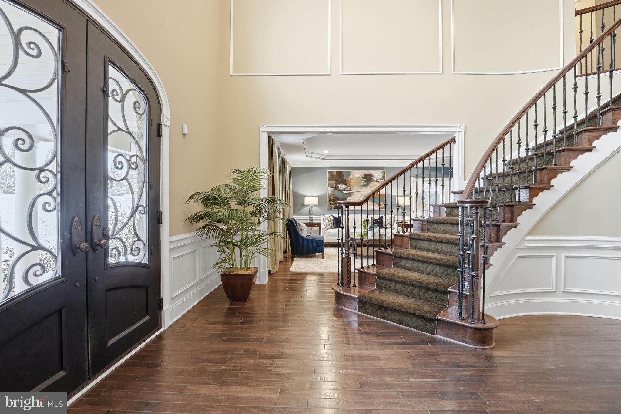 17972 Running Colt Place Leesburg, VA 20175 - Photo 9 of 99 a view of entryway and hall with wooden floor