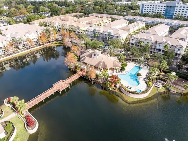 an aerial view of a house with a swimming pool