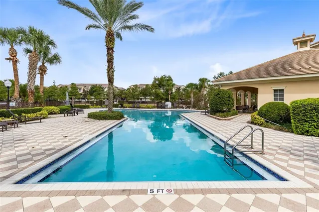 a view of a lake with houses in the back