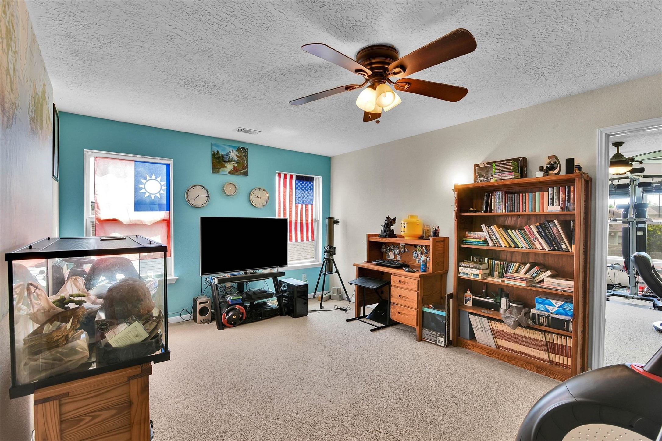 3003 Legends York Drive Spring, TX 77386 - Photo 16 of 29 a view of a livingroom with furniture and a flat screen tv