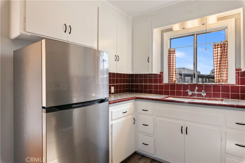 360 3rd Street Lakeport, CA 95453 - Photo 12 of 43 a kitchen with stainless steel appliances a refrigerator and a sink