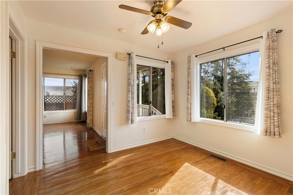 360 3rd Street Lakeport, CA 95453 - Photo 10 of 43 a view of empty room with wooden floor and fan