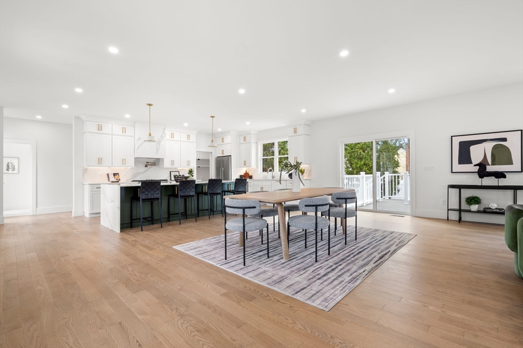 25 Sachem Road Needham, MA 02494 - Photo 16 of 40 a living room with furniture and a dining table with kitchen view