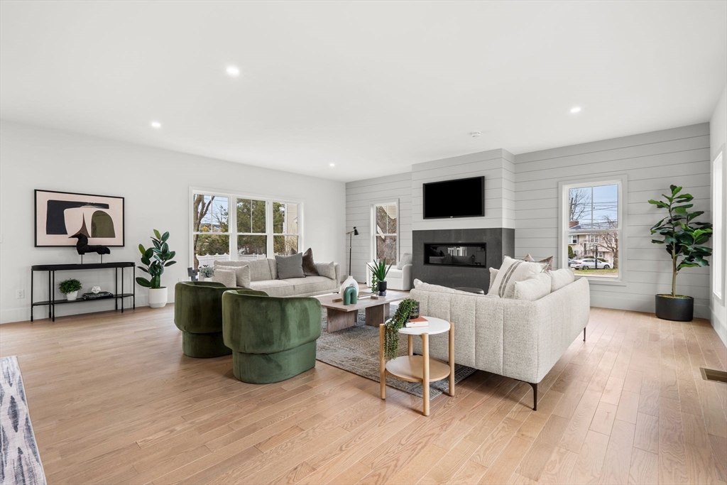 25 Sachem Road Needham, MA 02494 - Photo 19 of 40 a living room with furniture and a flat screen tv