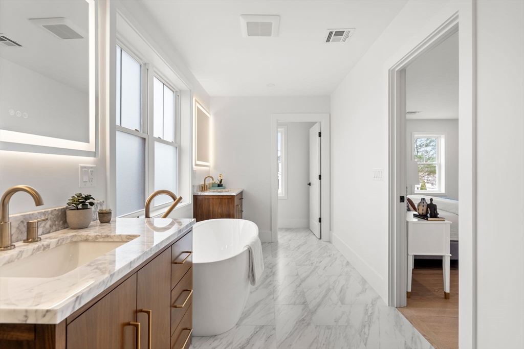 25 Sachem Road Needham, MA 02494 - Photo 27 of 40 a bathroom with a sink and a mirror