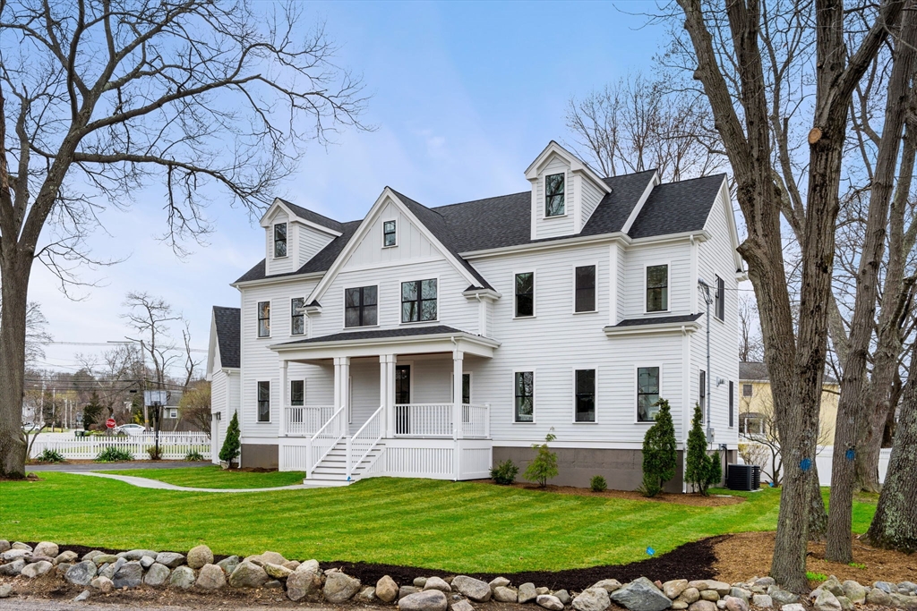 25 Sachem Road Needham, MA 02494 - Photo 3 of 40 a view of a white house with a big yard and large trees