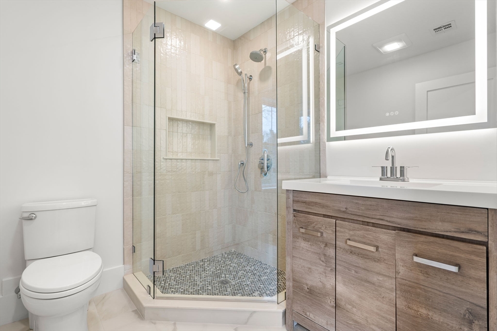 25 Sachem Road Needham, MA 02494 - Photo 33 of 40 a bathroom with a granite countertop sink toilet and shower