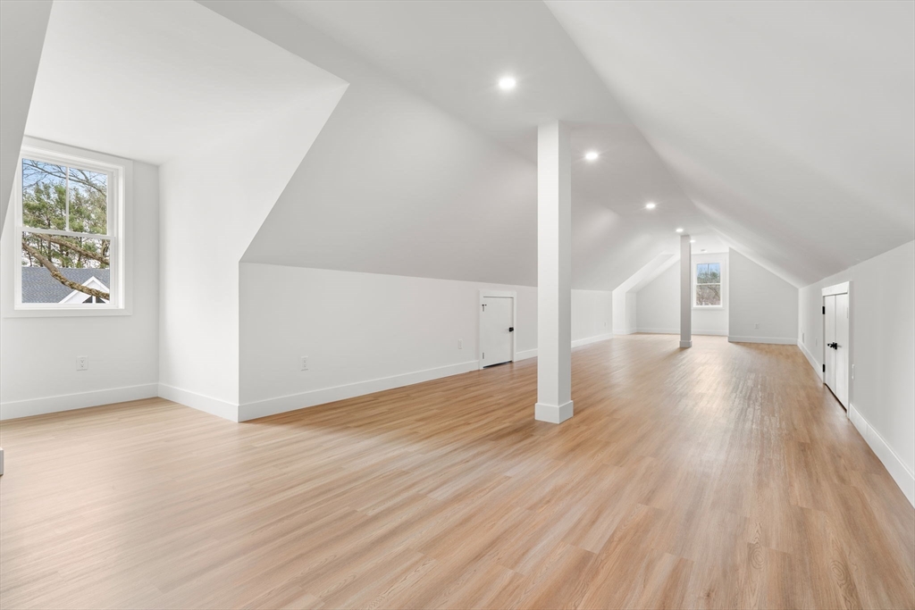 25 Sachem Road Needham, MA 02494 - Photo 39 of 40 an empty room with wooden floor and windows