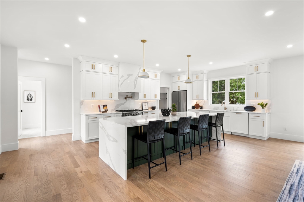 25 Sachem Road Needham, MA 02494 - Photo 6 of 40 a large kitchen with lots of counter space and stainless steel appliances
