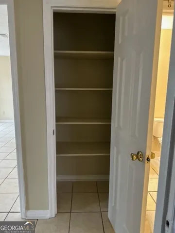 wooden floor in an empty room with a mirror
