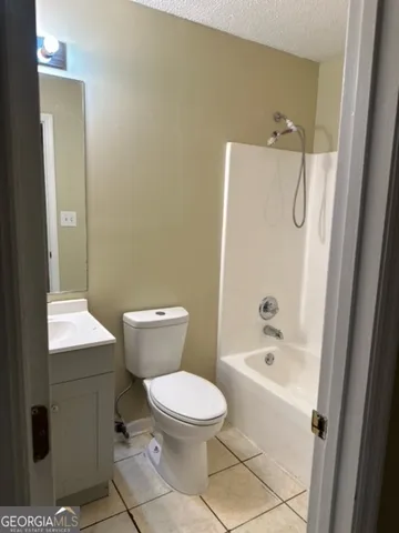 an empty room with wooden floor and closet