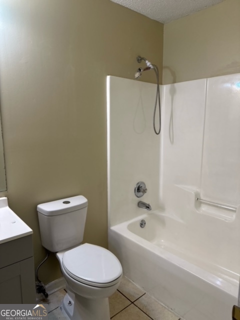 323 Carriage Lane, Unit B Albany, GA 31721 - Photo 22 of 23 a white toilet sitting next to a bath tub