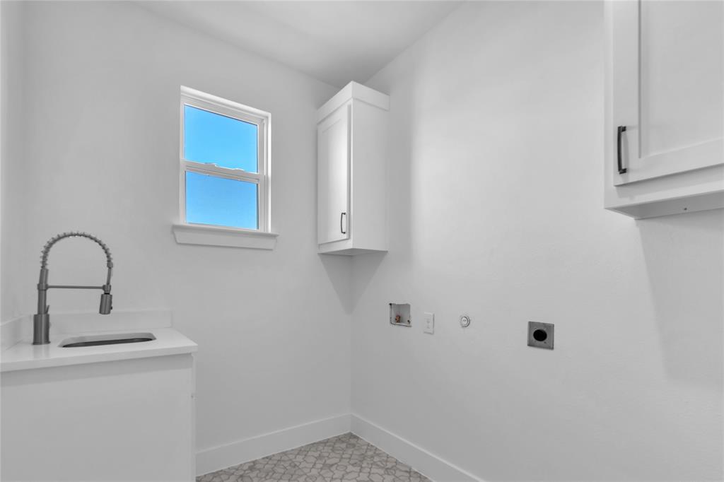 112 L B J Ranch Road Trinidad, TX 75163 - Photo 21 of 31 Laundry room with sink, hookup for an electric dryer, hookup for an electric dryer, cabinets, and hookup for a washing machine