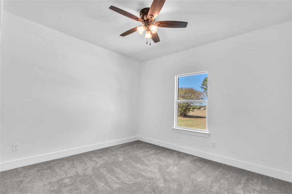 112 L B J Ranch Road Trinidad, TX 75163 - Photo 22 of 31 Carpeted 2nd Bedroom featuring lighted ceiling fan