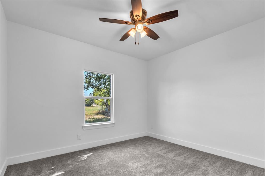 112 L B J Ranch Road Trinidad, TX 75163 - Photo 24 of 31 Carpeted 3rd Bedroom with lighted ceiling fan