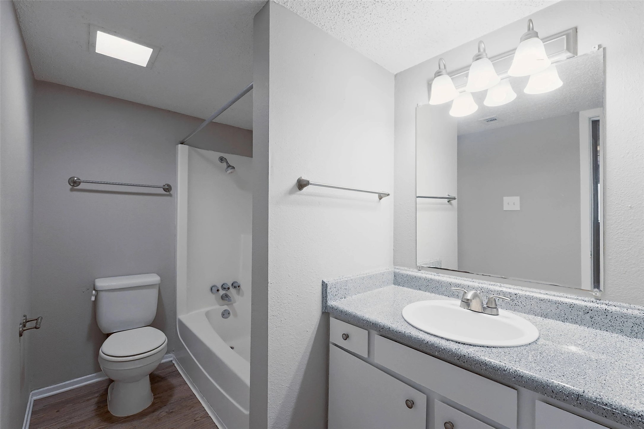 8100 North Mopac Expressway, Unit 7236 Austin, TX 78759 - Photo 18 of 24 a bathroom with a granite countertop sink a toilet and a mirror