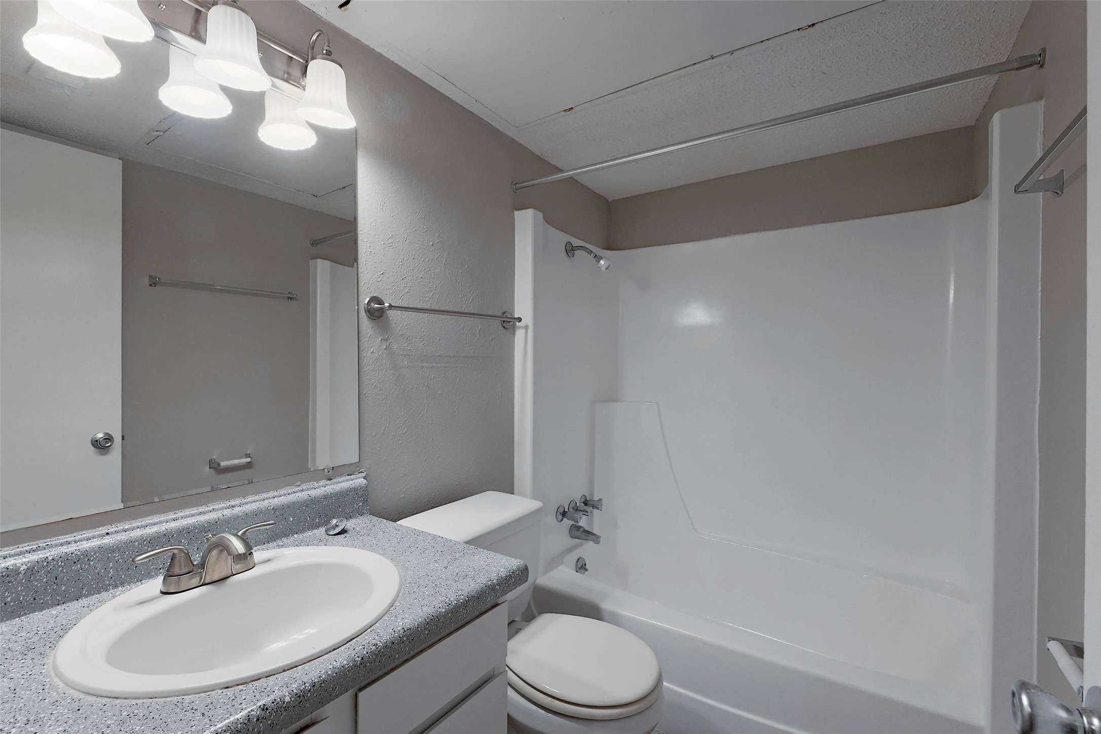 8100 North Mopac Expressway, Unit 7236 Austin, TX 78759 - Photo 22 of 24 a bathroom with a sink toilet a mirror and shower