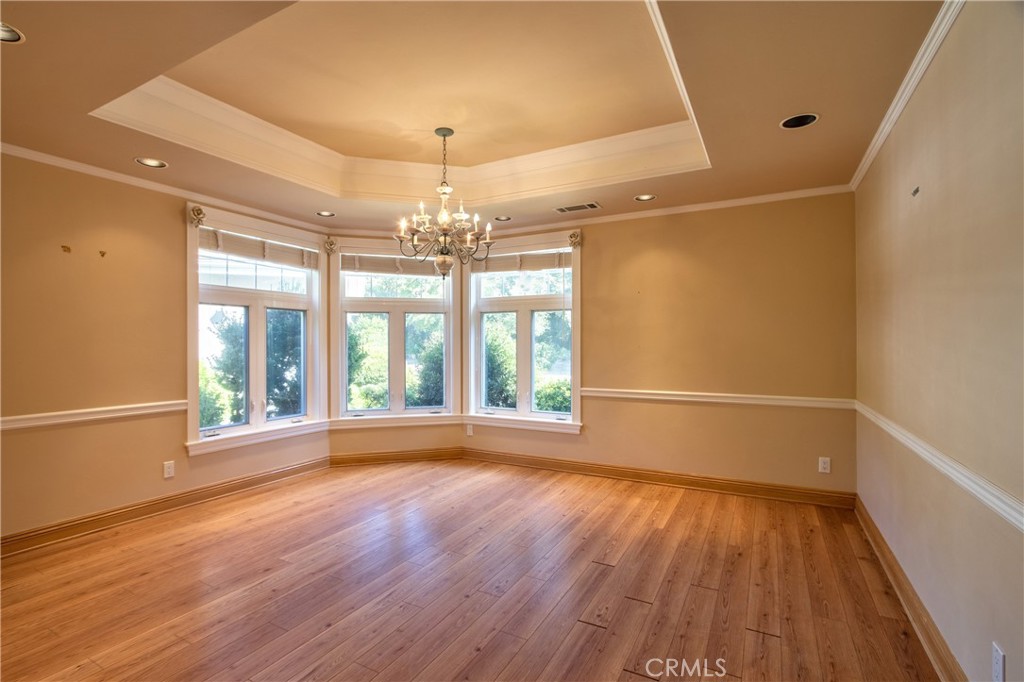 46341 El Prado Road Temecula, CA 92590 - Photo 11 of 52 a view of an empty room with wooden floor and a window