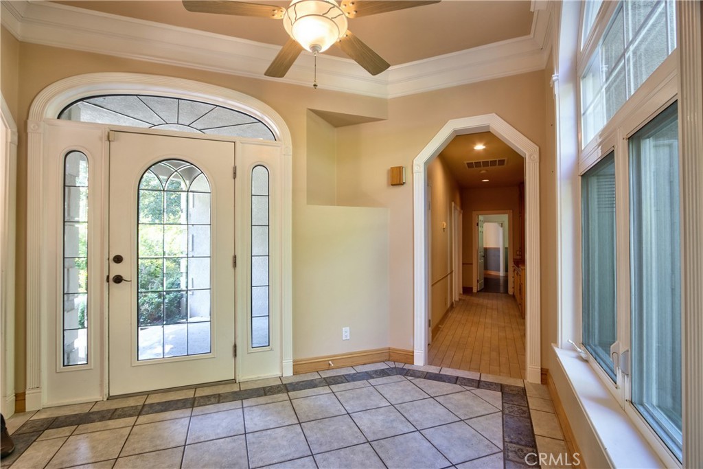46341 El Prado Road Temecula, CA 92590 - Photo 14 of 52 a view of a hallway with wooden floor and a chandelier