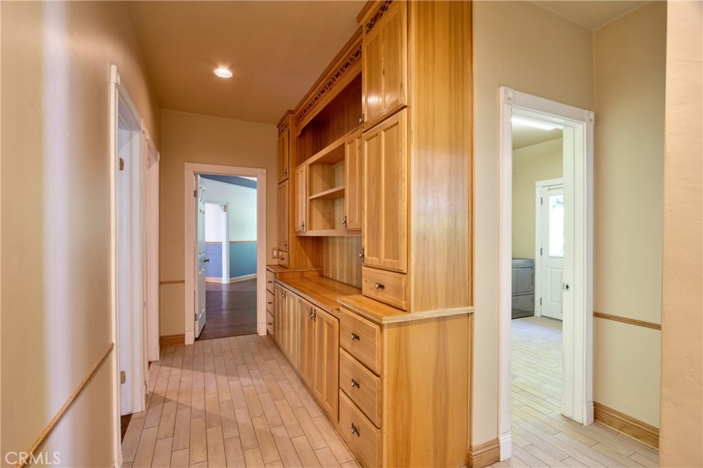 46341 El Prado Road Temecula, CA 92590 - Photo 15 of 52 a view of a hallway with wooden floor and staircase