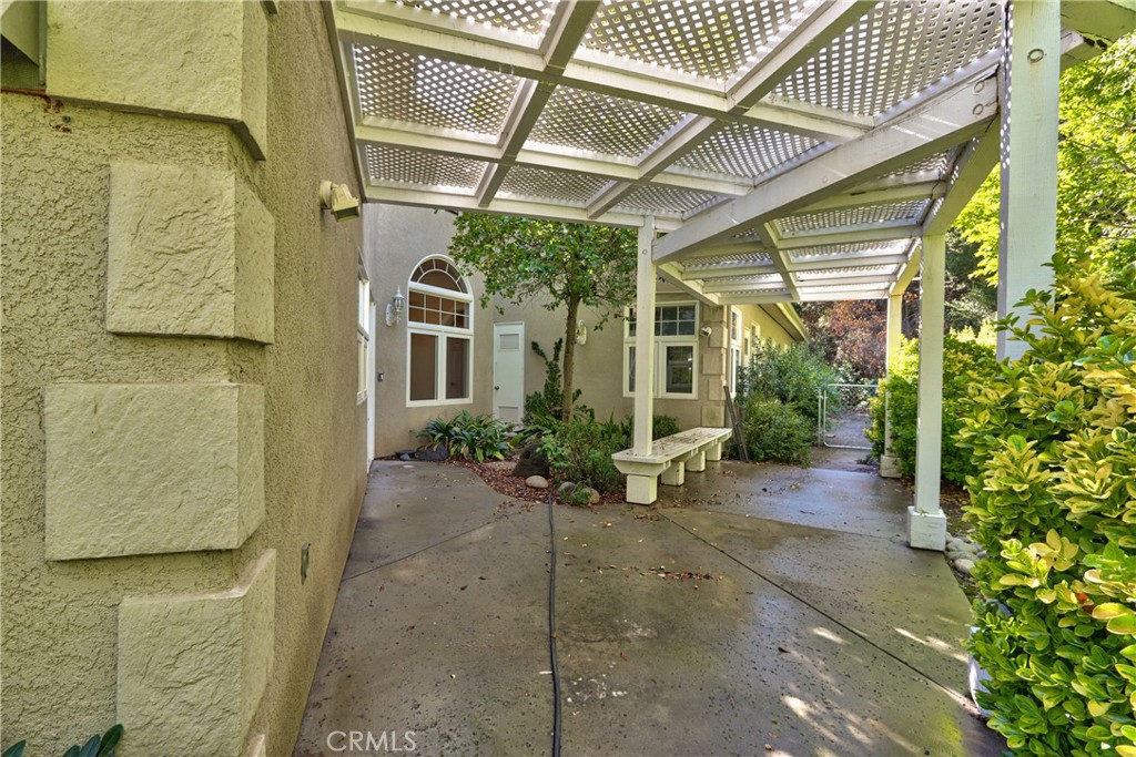 46341 El Prado Road Temecula, CA 92590 - Photo 26 of 52 a view of a porch with potted plants in front of door