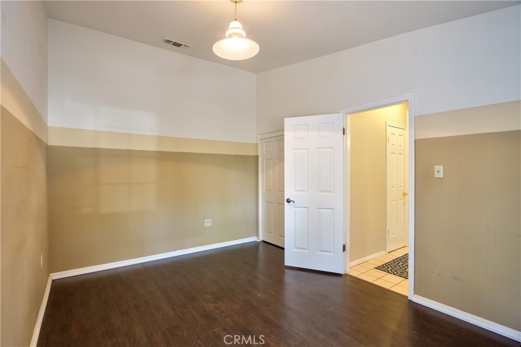 46341 El Prado Road Temecula, CA 92590 - Photo 34 of 52 a view of an empty room with wooden floor and a window