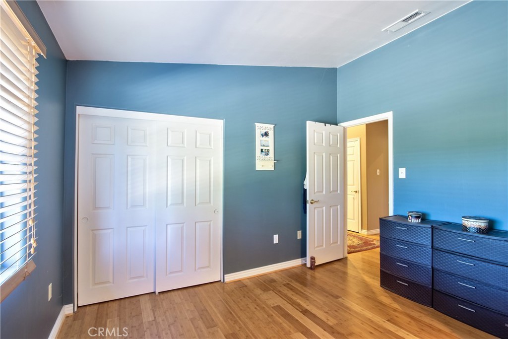 46341 El Prado Road Temecula, CA 92590 - Photo 35 of 52 a view of room with window and wooden floor