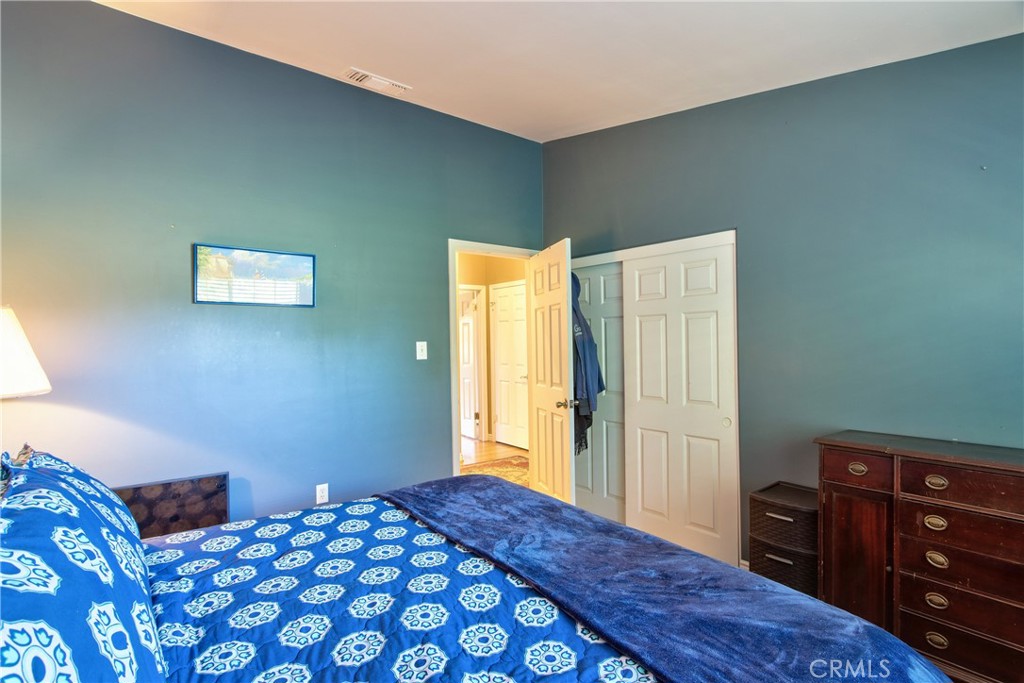 46341 El Prado Road Temecula, CA 92590 - Photo 36 of 52 a bedroom with a bed and a dresser in it