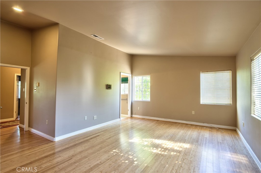 46341 El Prado Road Temecula, CA 92590 - Photo 38 of 52 an empty room with wooden floor and windows