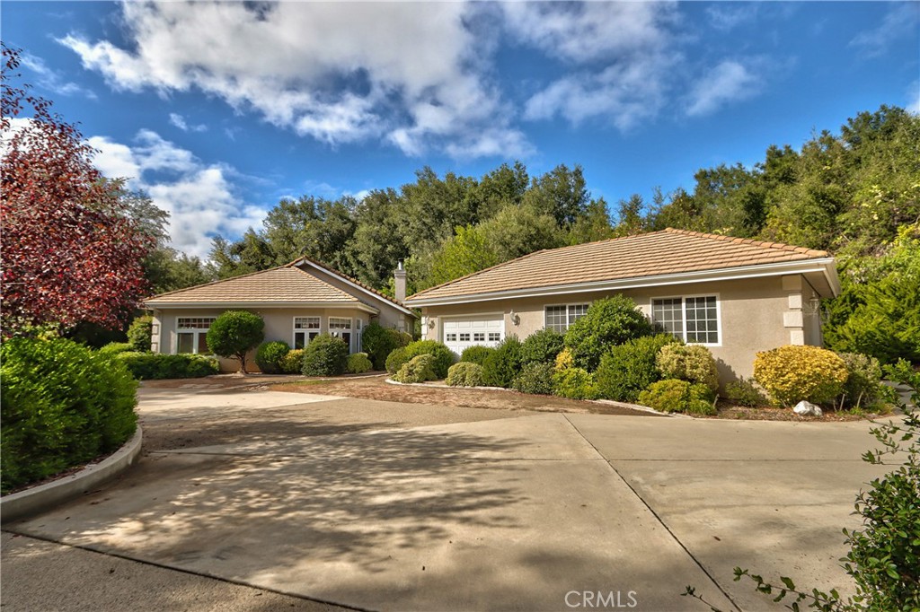 46341 El Prado Road Temecula, CA 92590 - Photo 4 of 52 a front view of a house with a yard