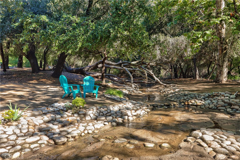 46341 El Prado Road Temecula, CA 92590 - Photo 43 of 52 a backyard of a house with table and chairs