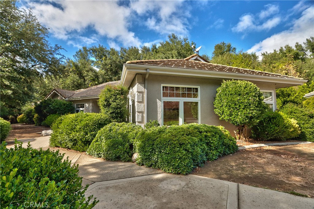 46341 El Prado Road Temecula, CA 92590 - Photo 5 of 52 a front view of a house with a yard