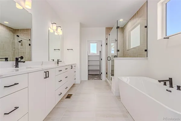 a white bath tub sitting in a bathroom