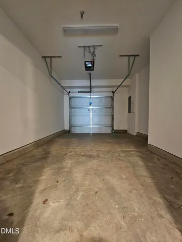 a view of an empty room with windows