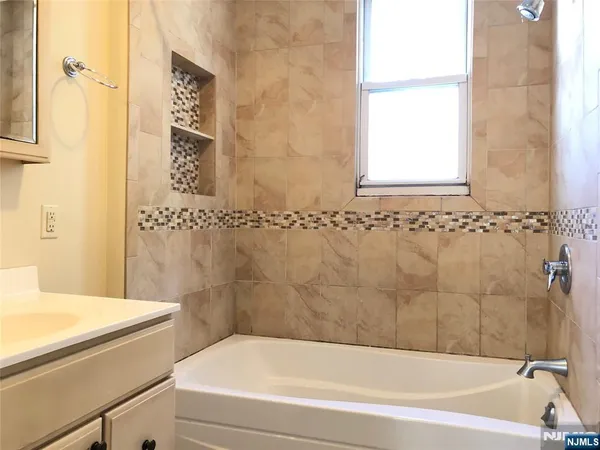 a bathroom with a sink and a bathtub