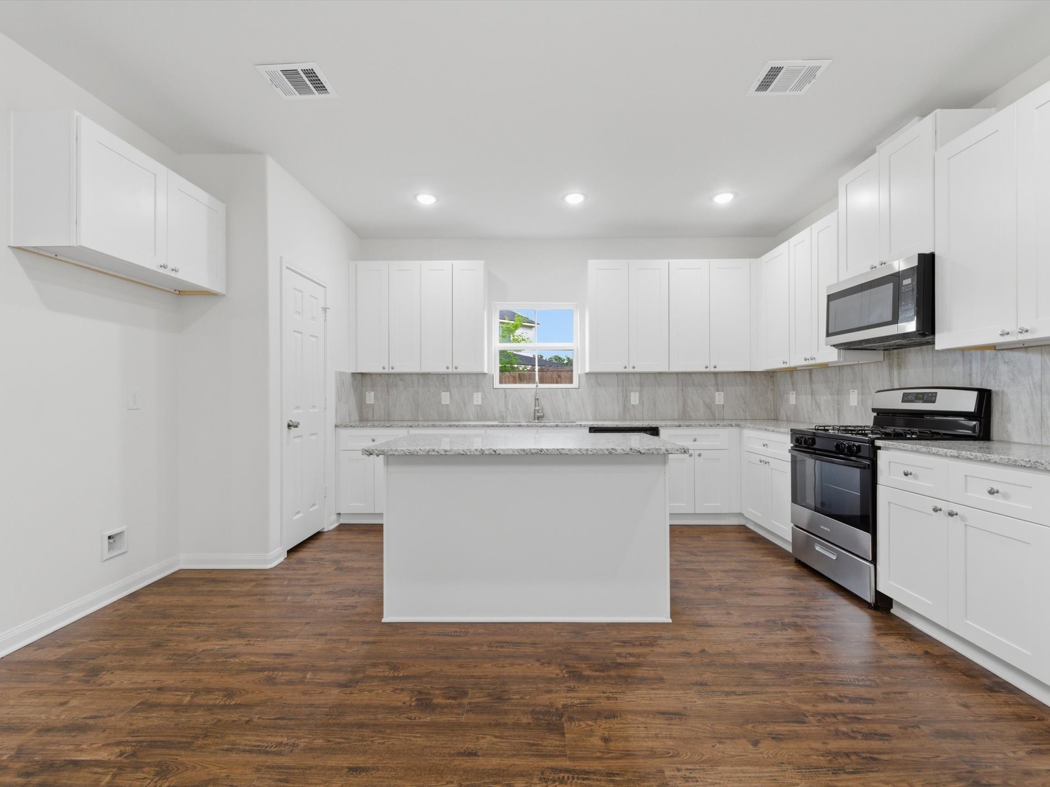 2803 Topiary Lane Houston, TX 77014 - Photo 12 of 30 Designed to impress, the kitchen features granite countertops, stainless steel appliances, soft-close cabinetry, and a spacious walk-in pantry for exceptional storage and everyday ease.