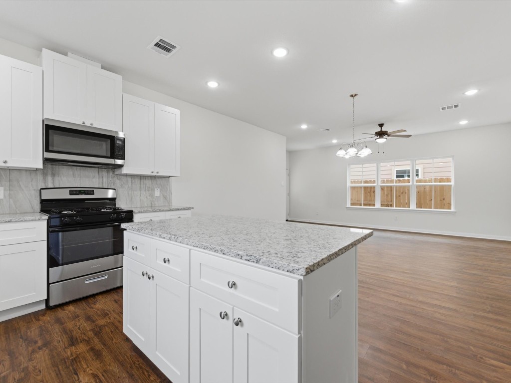 2803 Topiary Lane Houston, TX 77014 - Photo 15 of 30 The seamless flow from the kitchen to the living space keeps everyone connected and makes entertaining effortless.