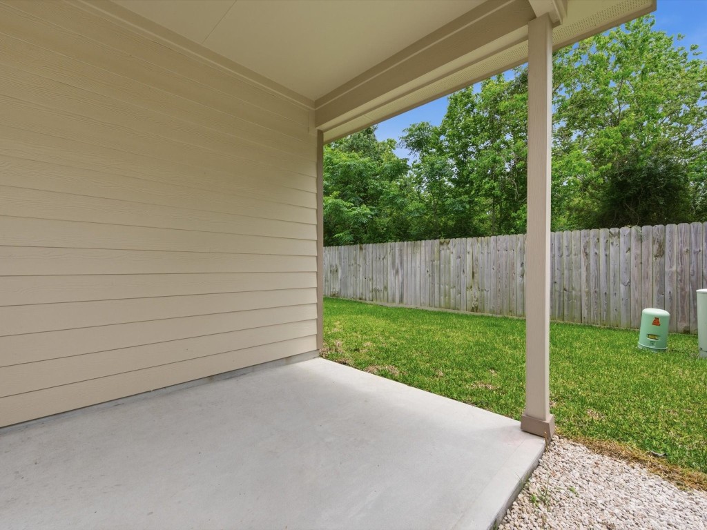2803 Topiary Lane Houston, TX 77014 - Photo 27 of 30 Enjoy outdoor living with a covered back patio that extends your living space and creates the perfect setting for relaxing or entertaining.