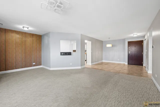 a view of an empty room with a cabinet
