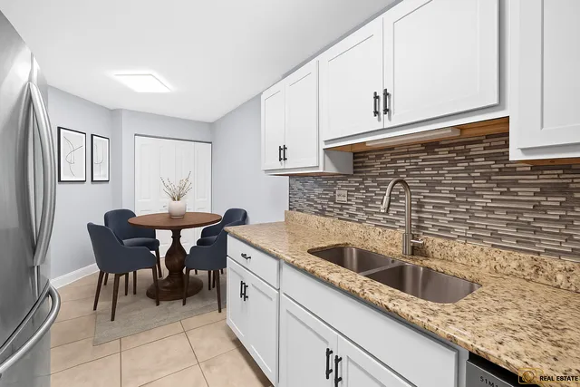 a kitchen with a sink and cabinets