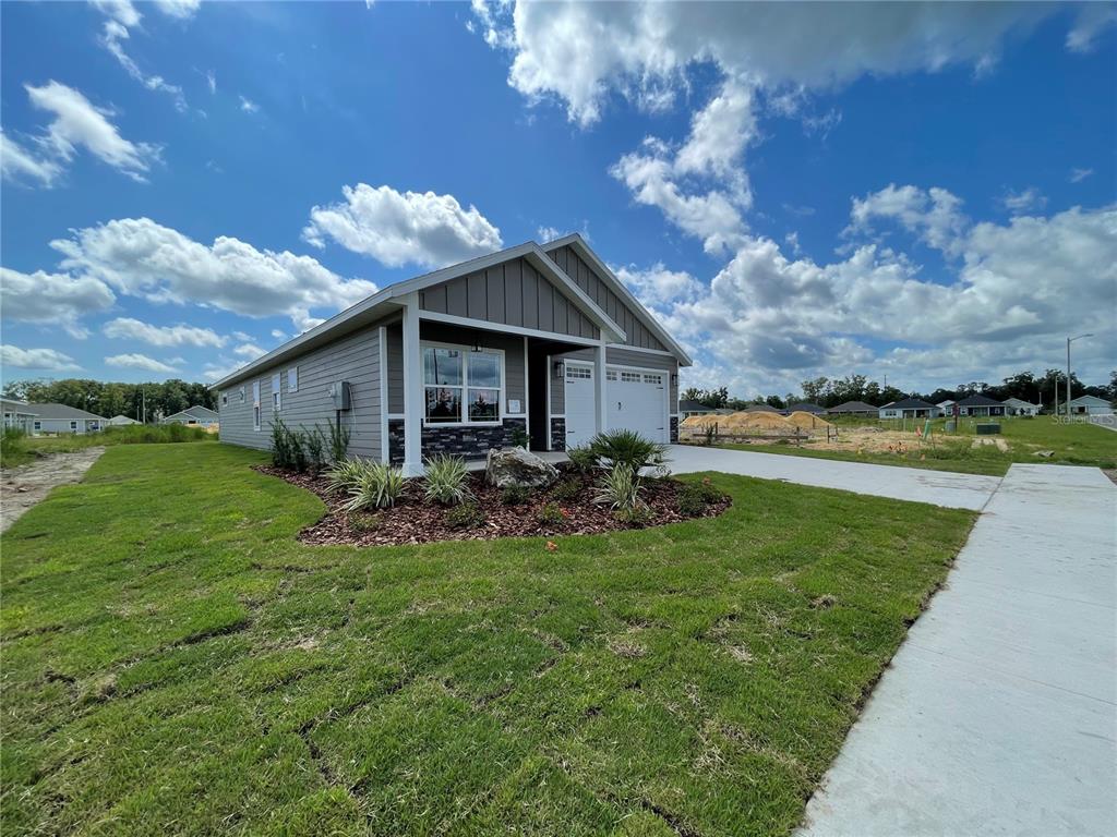 1021 Southwest 67th Street Gainesville, FL 32607 - Photo 41 of 53 a view of a house with backyard porch and garden
