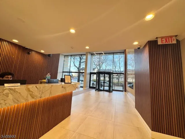 a large swimming pool with a large window and balcony view